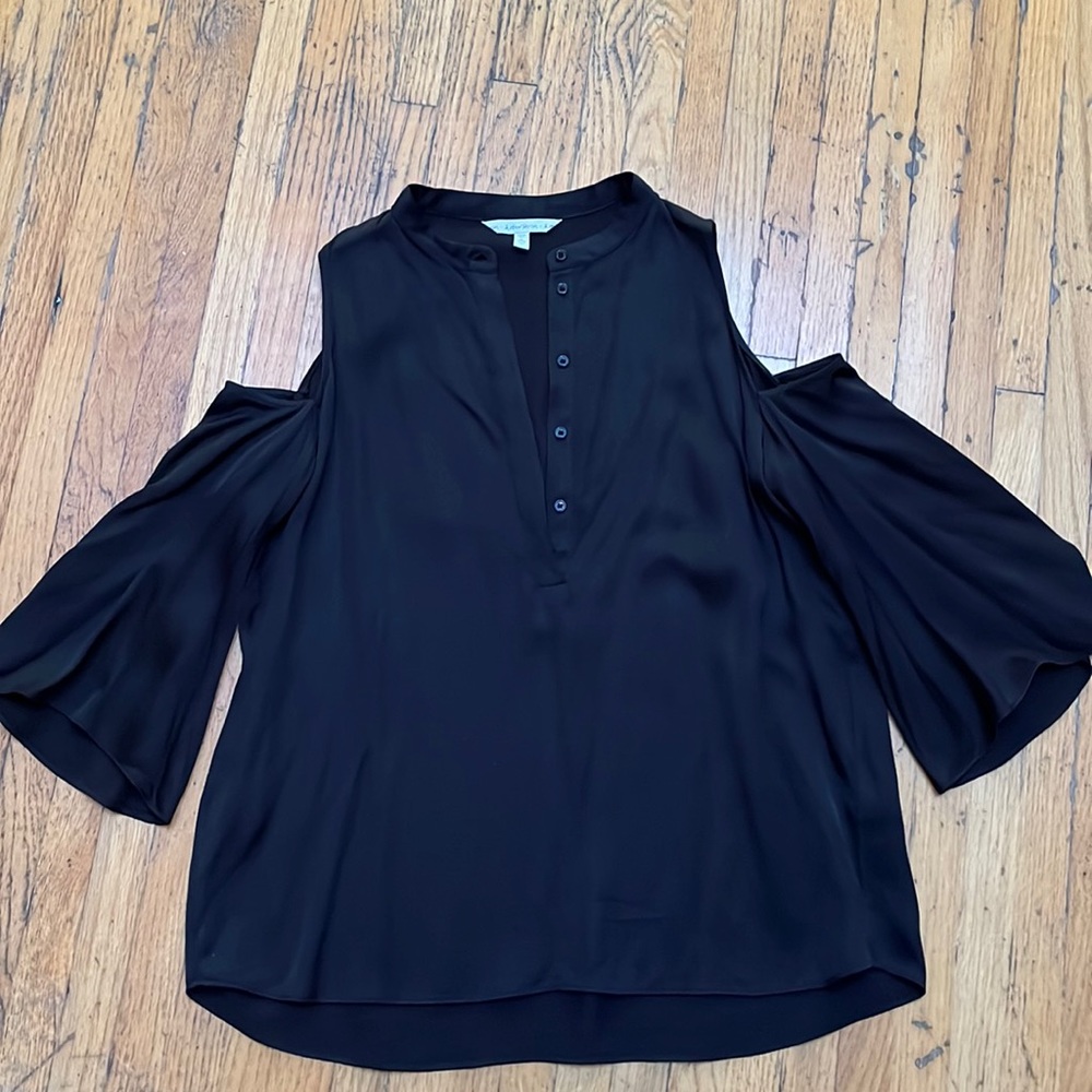 black cold shoulder silk shirt. Sleeves are slightly flowy. Pull by shoulder